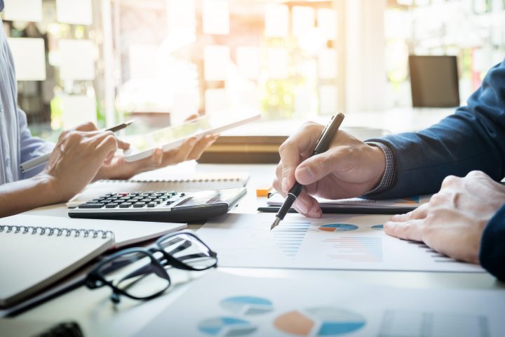 business man financial inspector secretary making report calculating checking balance internal revenue service inspector checking document audit concept e1622790875550